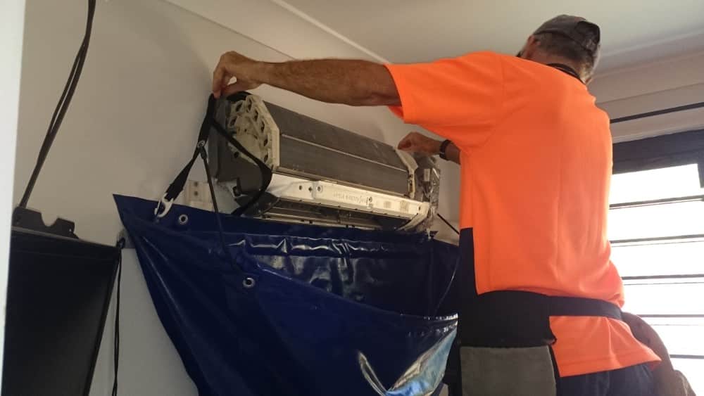 Covering an aircon prior to cleaning